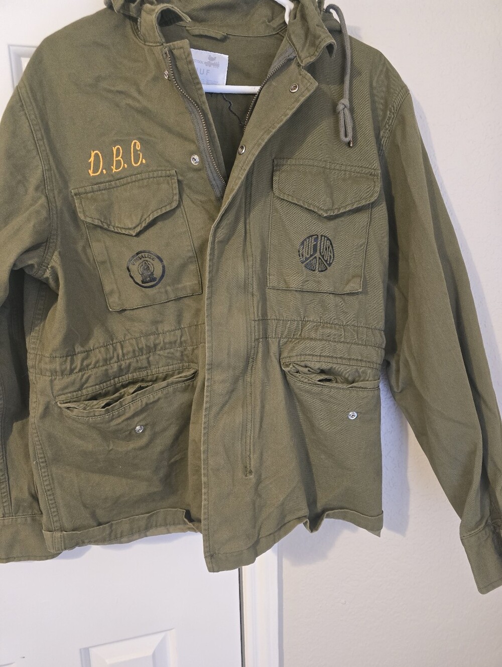 HUF X Woodstock Olive Green Hooded Mens Jacket with Pocket Patches And Hood
